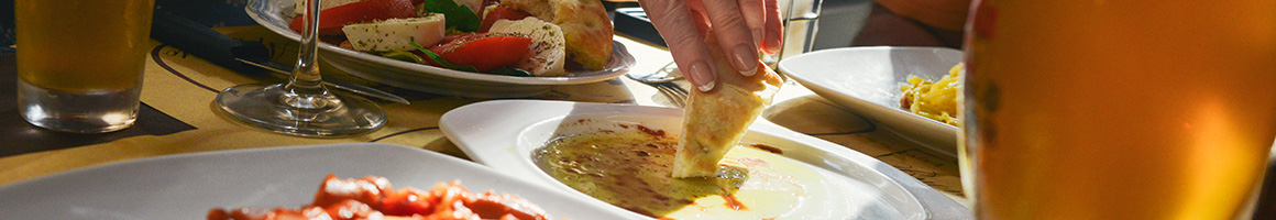 Eating British Pub Food at Elephant & Castle restaurant in Boston, MA.